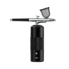 A black mini air compressor nail art spray tool with a silver nozzle and housing.