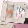 A beige leather case holds a professional stainless steel nail clipper and grooming set with various metal tools.