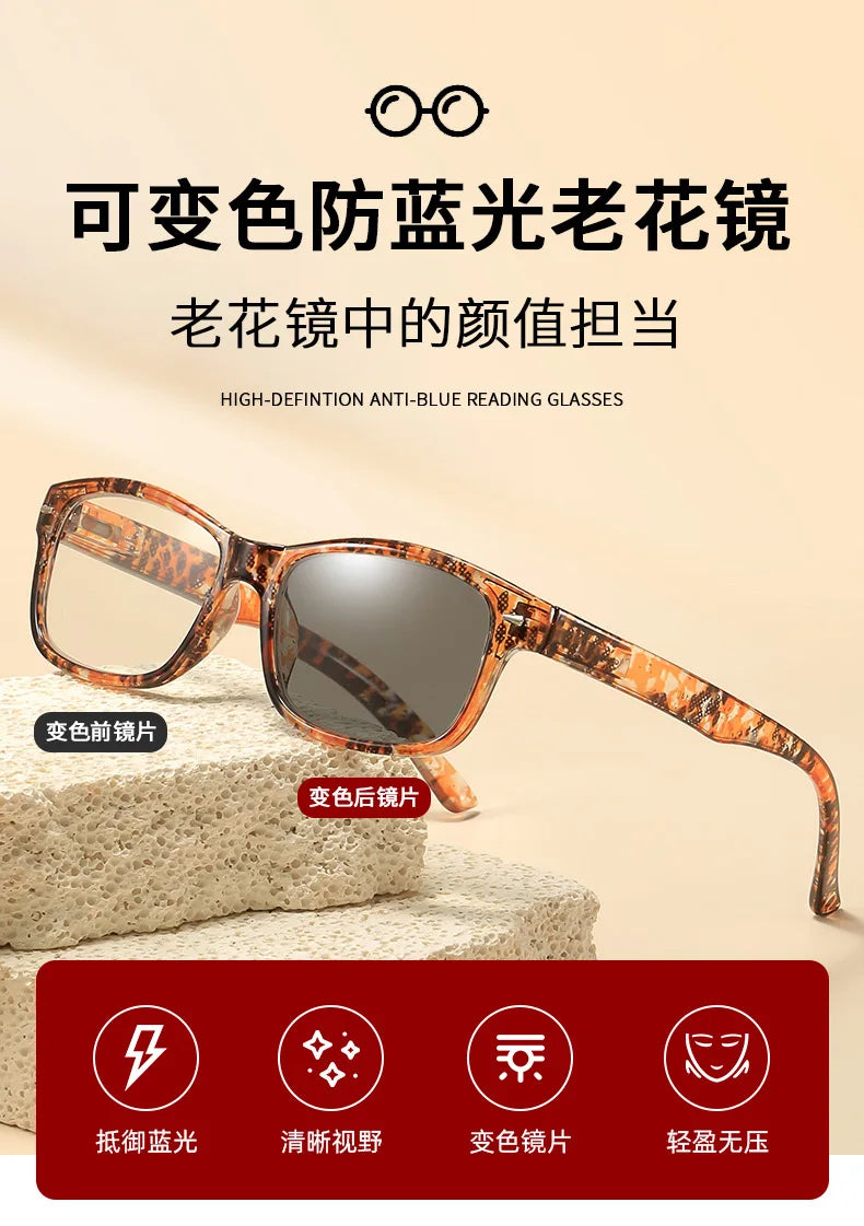 A pair of brown-framed photochromic reading glasses with anti-blue light protection displayed on a textured surface.