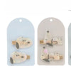 A set of Snoopy cartoon hair clips featuring white and gray designs on a clear background.