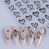 Un set de 3D autocollants cœur d'amour pour vernis à ongles DIY, présenté sur une surface blanche.