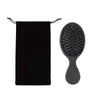 A black hair extension brush set featuring a round boar bristle brush and a black fabric pouch.