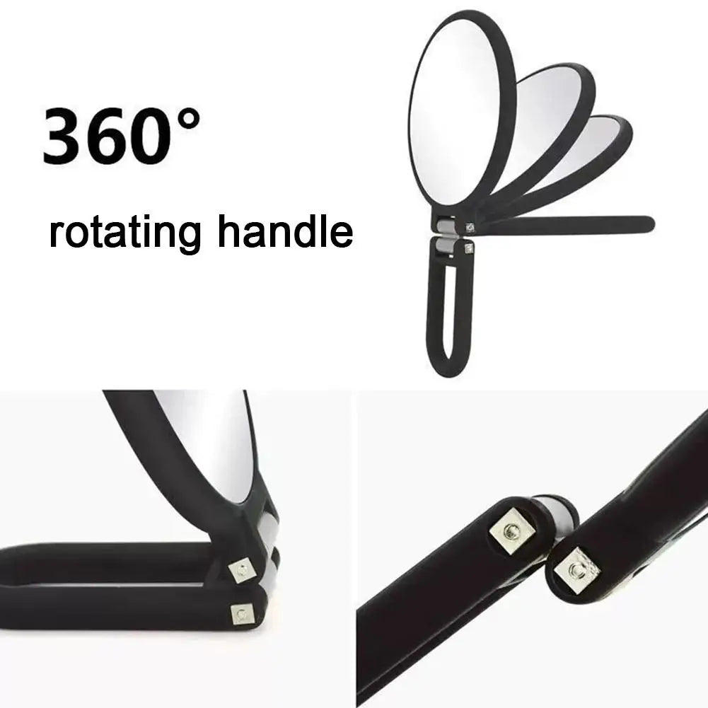 Miroir voyage avec poignée noire rotative et multiples surfaces réfléchissantes.