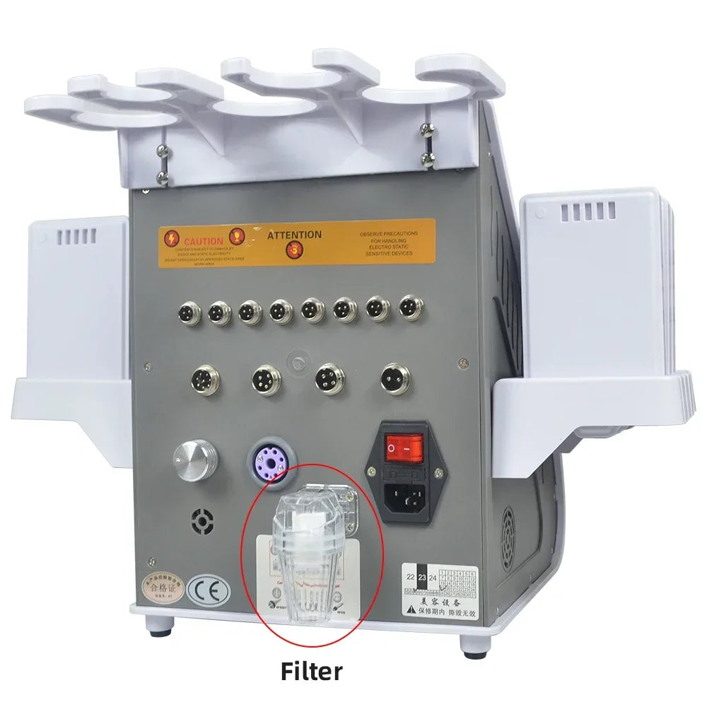 A gray hand massage and body slimming tool with multiple attachments and a filter visible on the front panel.