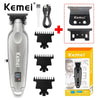 A Kemei cordless electric hair trimmer with multiple attachments and a box.