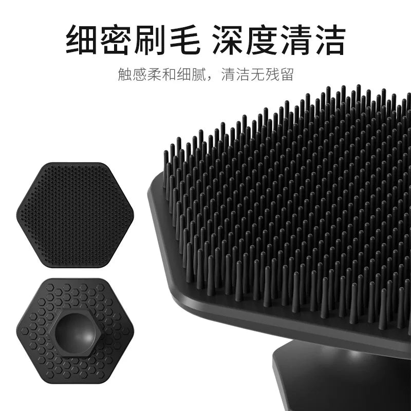 A black silicone facial cleaning brush with multiple bristles shown alongside its detached head.