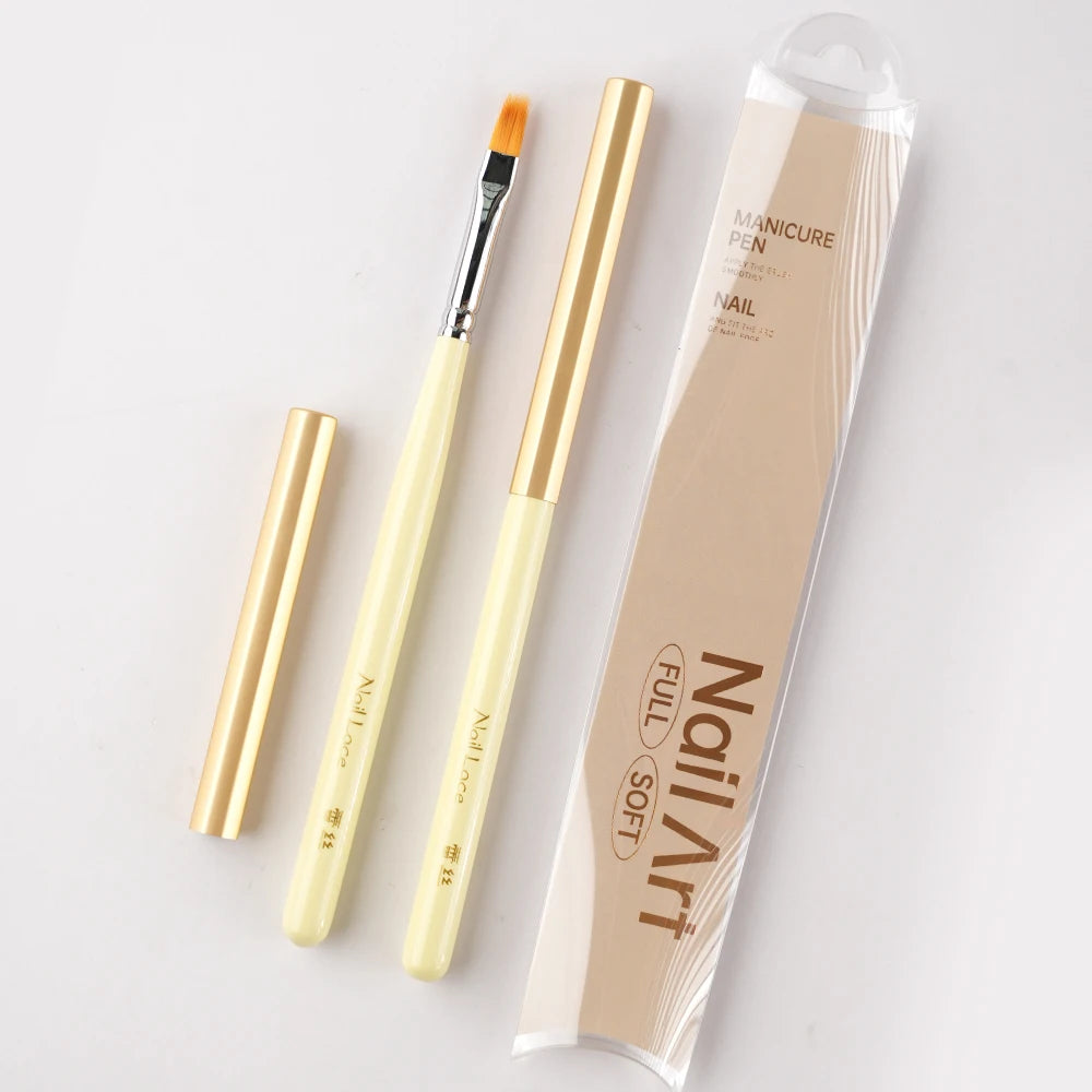 A set of professional nail art brushes and a manicure pen packaged in a clear tube.