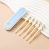 A clear plastic case holds several light-colored double-sided nose hair razors resting on a beige surface.