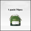 A green package containing 70 disposable soft cotton face towels for cleansing and makeup removal.