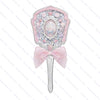 A pink pearl hand mirror with a decorative frame and a silver handle for makeup and beauty.