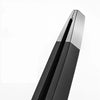 A close-up view of precision stainless steel eyebrow tweezers with a black and silver design.