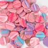 A collection of pink and purple air cushion beauty puffs in various shades and colors.