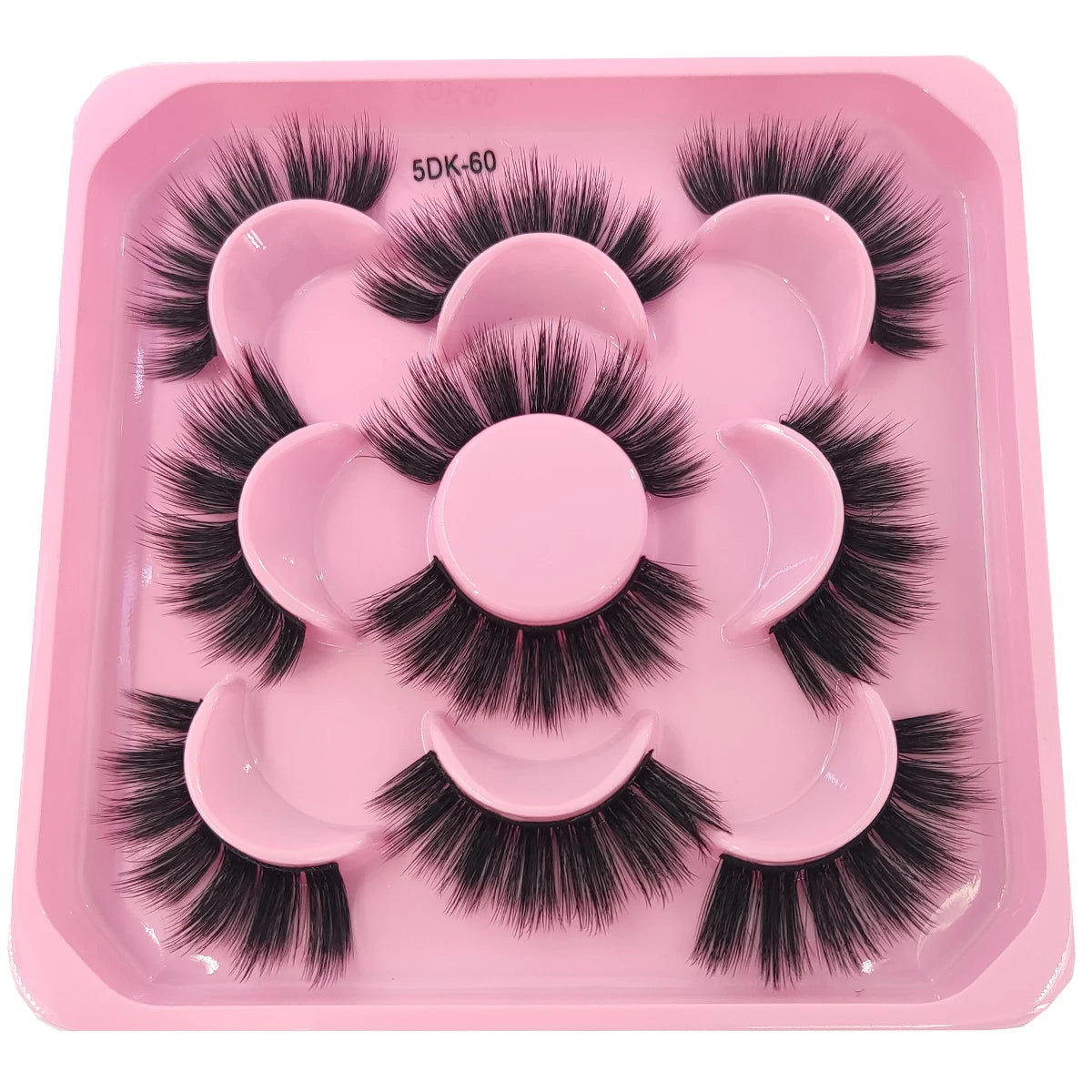 A pink tray containing a set of black artificial mink eyelashes for eye extensions.