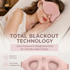 Una mujer duerme cómodamente usando una máscara para los ojos rosa con contorno 3D en su cara.