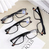 A set of black and tortoiseshell multifocal reading glasses displayed on a white background.