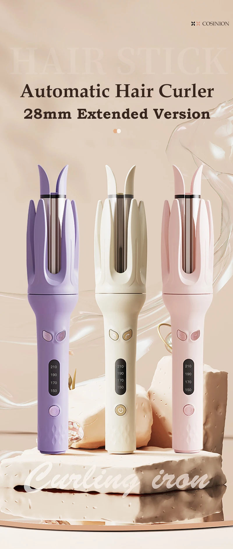 Three automatic hair curlers in purple, white, and pink are displayed on a cake.