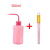 A pink 500ml bottle of eyelash extension cleaning solution with a precision applicator brush.