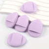 Several lavender latex-free finger puffs are displayed on a white surface.