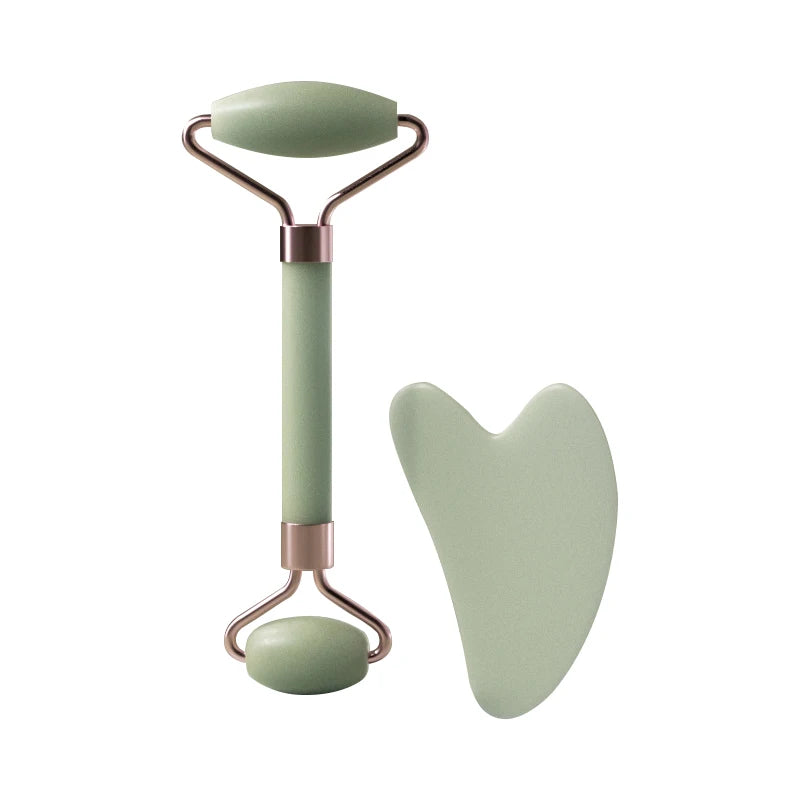 A rose gold and sage green resin facial massage roller set with a handle and a paddle.