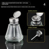 A clear glass bottle with a metal tube and anti-spray liquid pump dispenser.