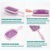A set of purple perforated hair brushes with ergonomic handles for detangling and styling.