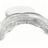 A clear, U-shaped dental whitening tray with a white plastic base and internal light elements.