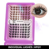 A purple plastic box containing individual black eyelash clusters for DIY lash extensions.