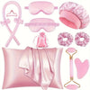 A pink heatless curling kit featuring silk accessories including a hair tool, pads, and a pillow.