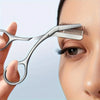 Stainless steel eyebrow scissors with a comb being used to shape an eyebrow on a woman's face.