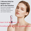 A woman is using a pink eye massager wand on her face for rejuvenation.