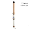 A professional electric hair curler in a beige and white color with an LCD control panel.
