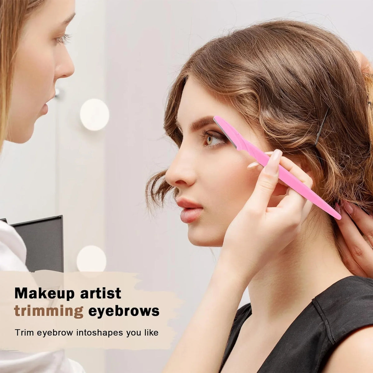 A woman is shown receiving eyebrow trimming by a makeup artist using a pink trimmer on her eyebrow.