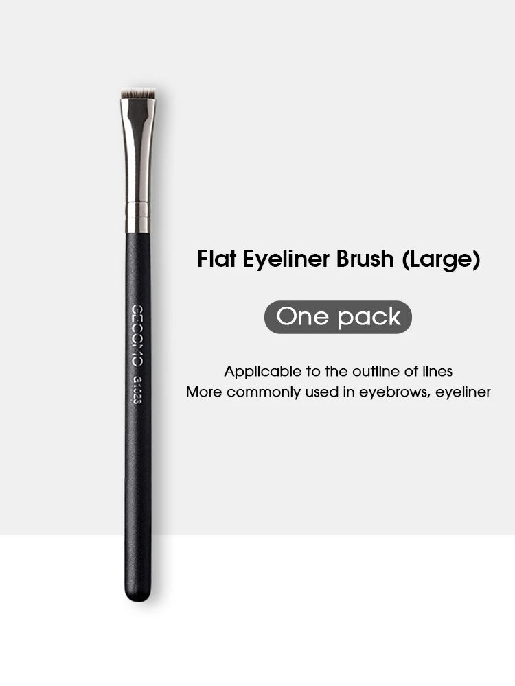 A black flat eyeliner brush is shown standing vertically against a white background.
