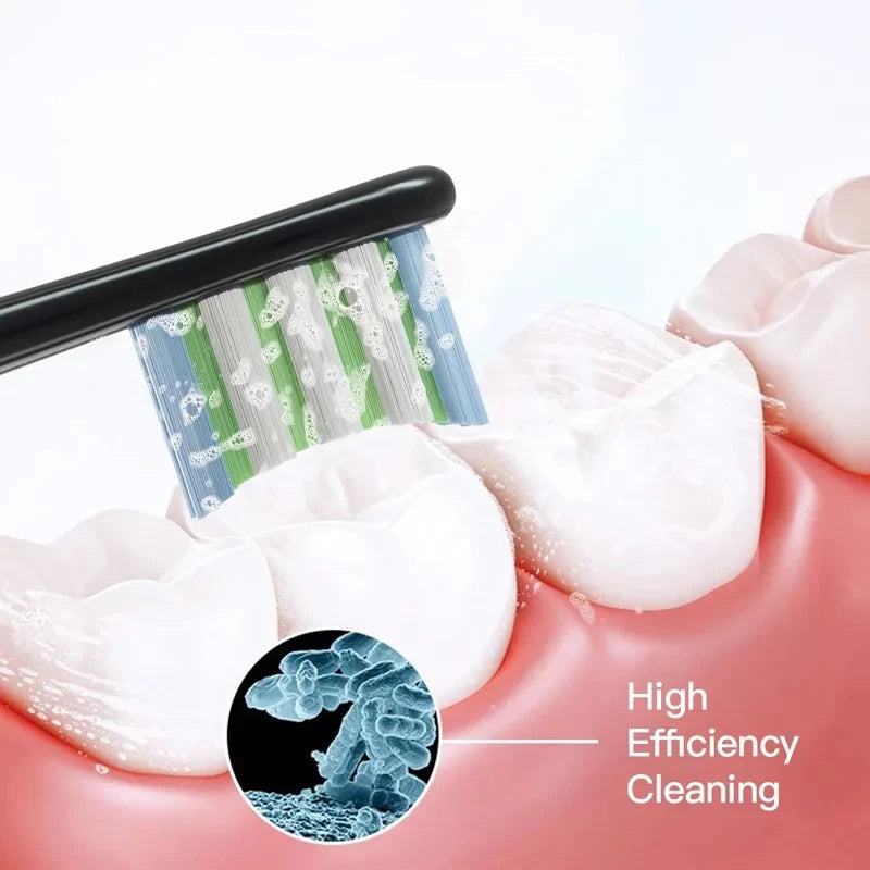 Close-up of replacement bristles being placed onto a pink toothbrush head for high efficiency cleaning.