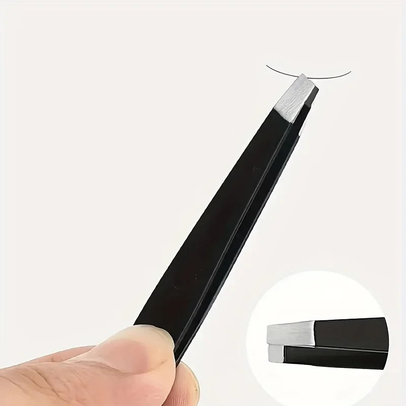 A hand holds a black precision stainless steel tweezer set for eyebrow grooming, showing the tips of the tweezers.