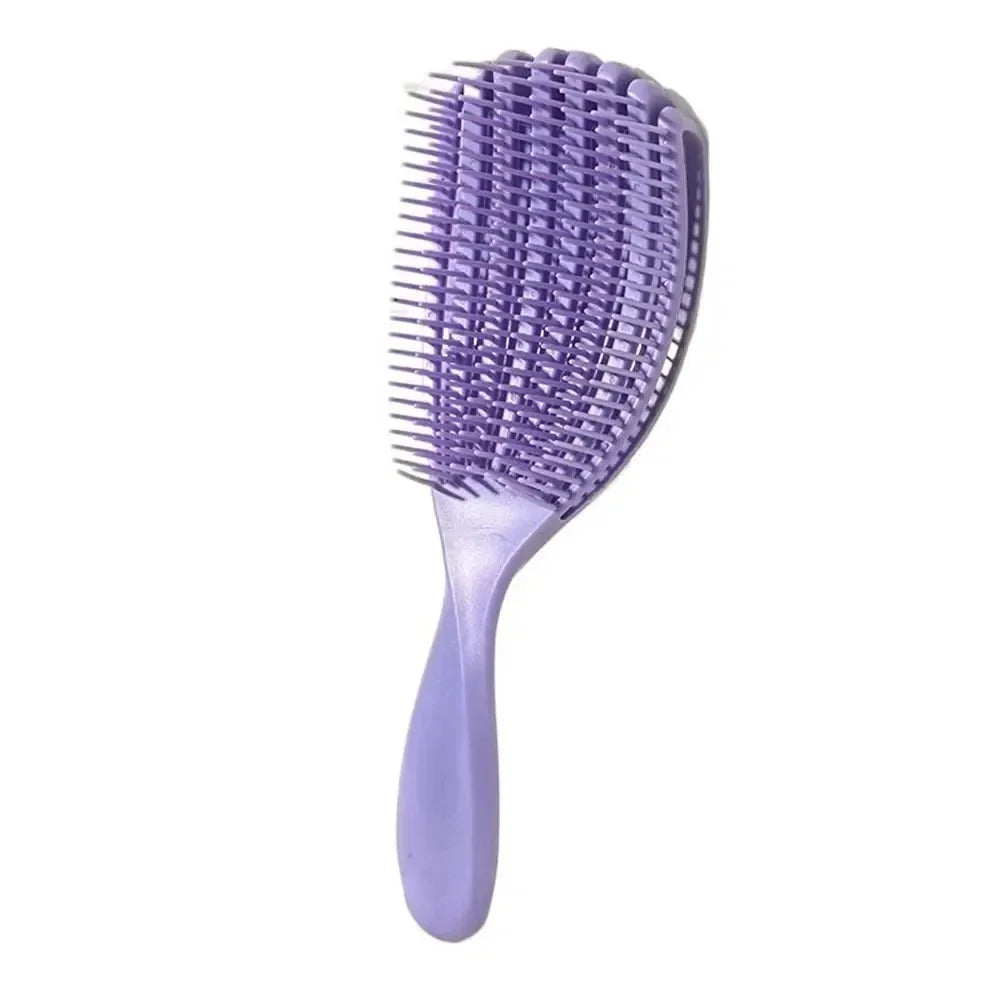 A purple massage detangler hair brush for curly and thick hair.
