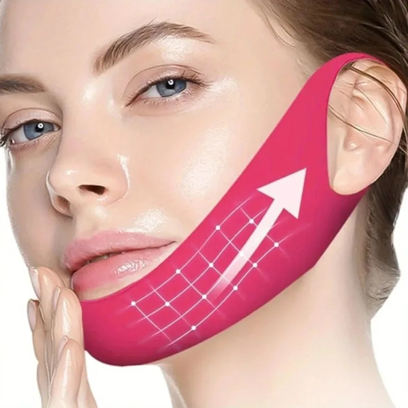 A woman applying a pink V-line face lifting and slimming mask set to her cheek.