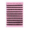 A pink plastic tray holding various sizes of eyelash extensions for curling and styling.