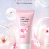 A pink tube of Japan Sakura Cleanser with a white cap is shown against a soft, light background.