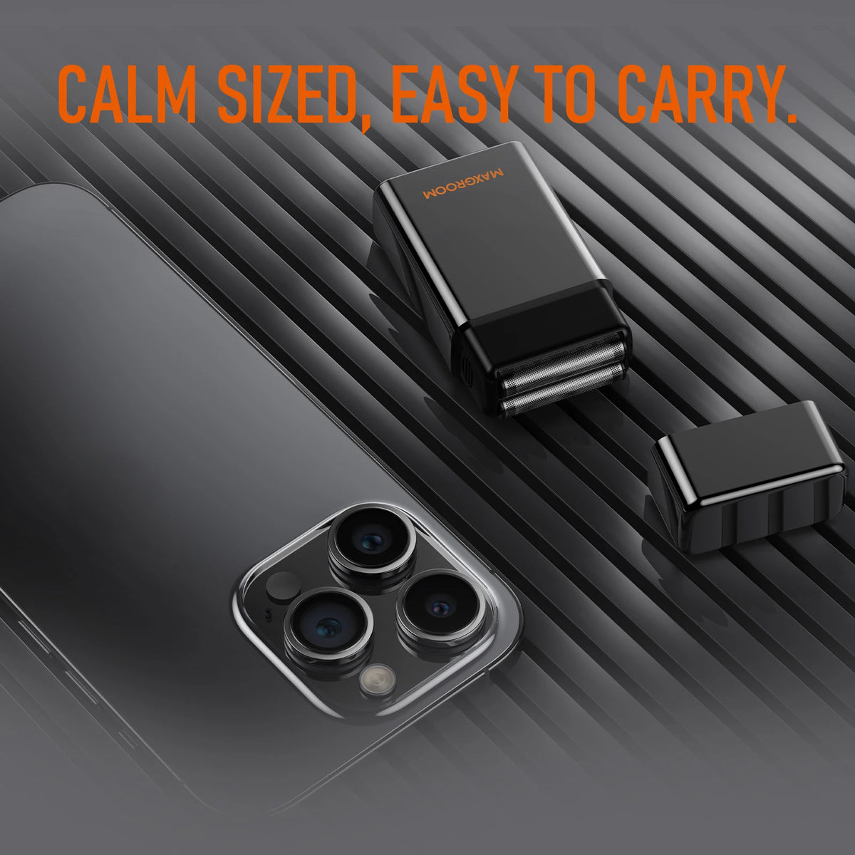 A black electric shaver and a smartphone are shown on a dark surface with text reading Calm Sized Easy to Carry.