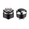 A black precision electric shaver with magnetic charging components visible.