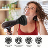 A woman is using a black silicone diffuser cover for a hair dryer in a bright indoor setting.