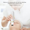 A person is using an ultrasonic facial scrubber device on their face for cleansing and skincare.