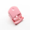 A pink mini folding eyelash curler set shown from above.