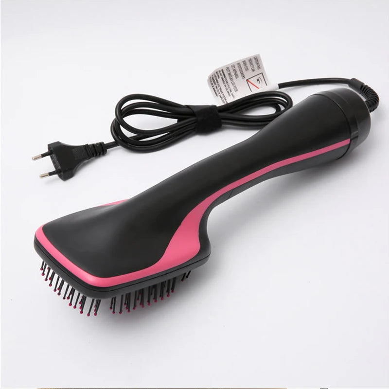 A black hair dryer brush and curling comb with a pink accent, shown against a white background.