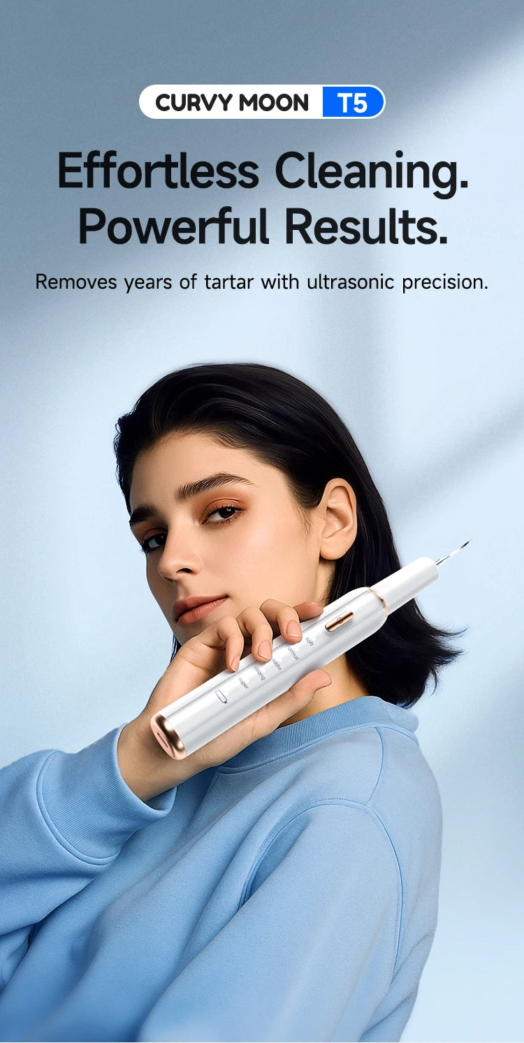 A woman holds a white smart ultrasonic tooth cleaner device against her face.
