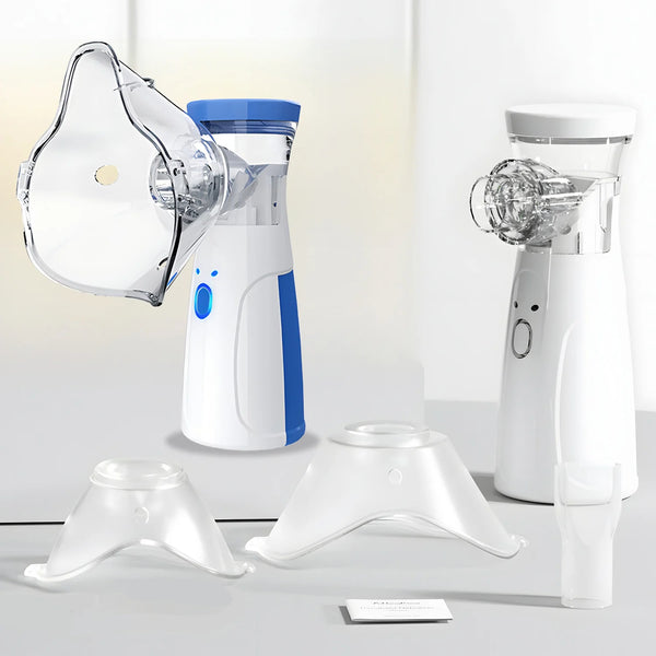 A white portable ultrasonic nebulizer device and accessories are shown on a light gray surface.