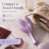 A purple portable anti-static hair comb for scalp massage is shown next to a beige cosmetic pouch and sunglasses.