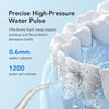 A close-up of a mini cordless water flosser creating a high-pressure water pulse between teeth on a white tooth model.