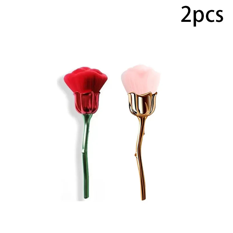 A set of two nail art dust brushes, one red and one pink, with gold-toned handles.